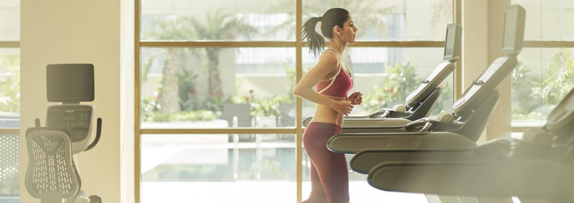 Taj Swarna, Amritsar Hotel Екстериор снимка A woman exercising on a treadmill